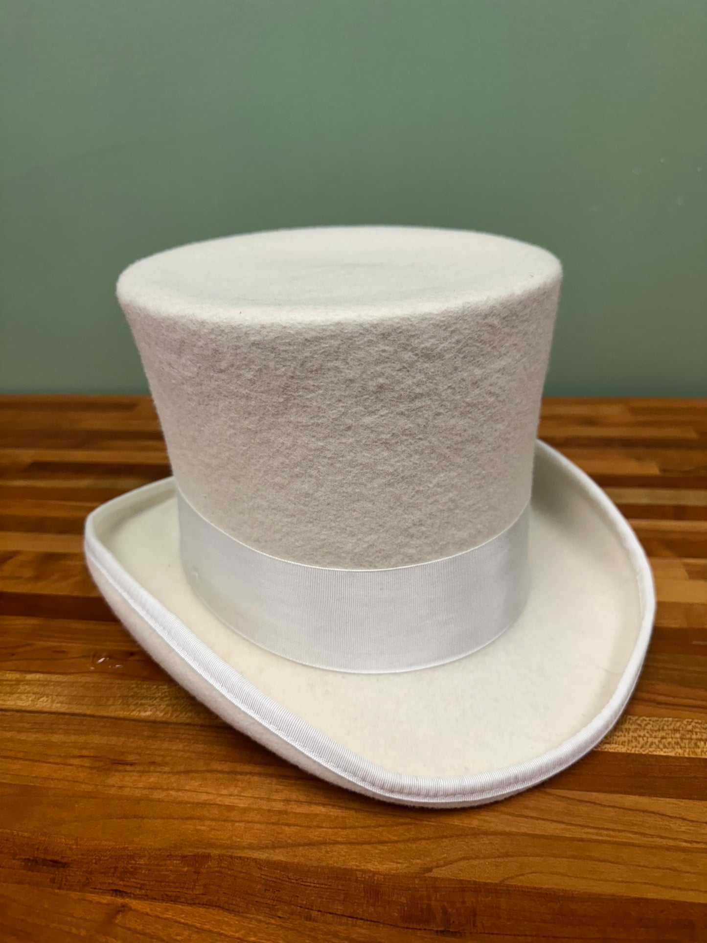 White Felt Top Hat With White Ribbon and Feathers