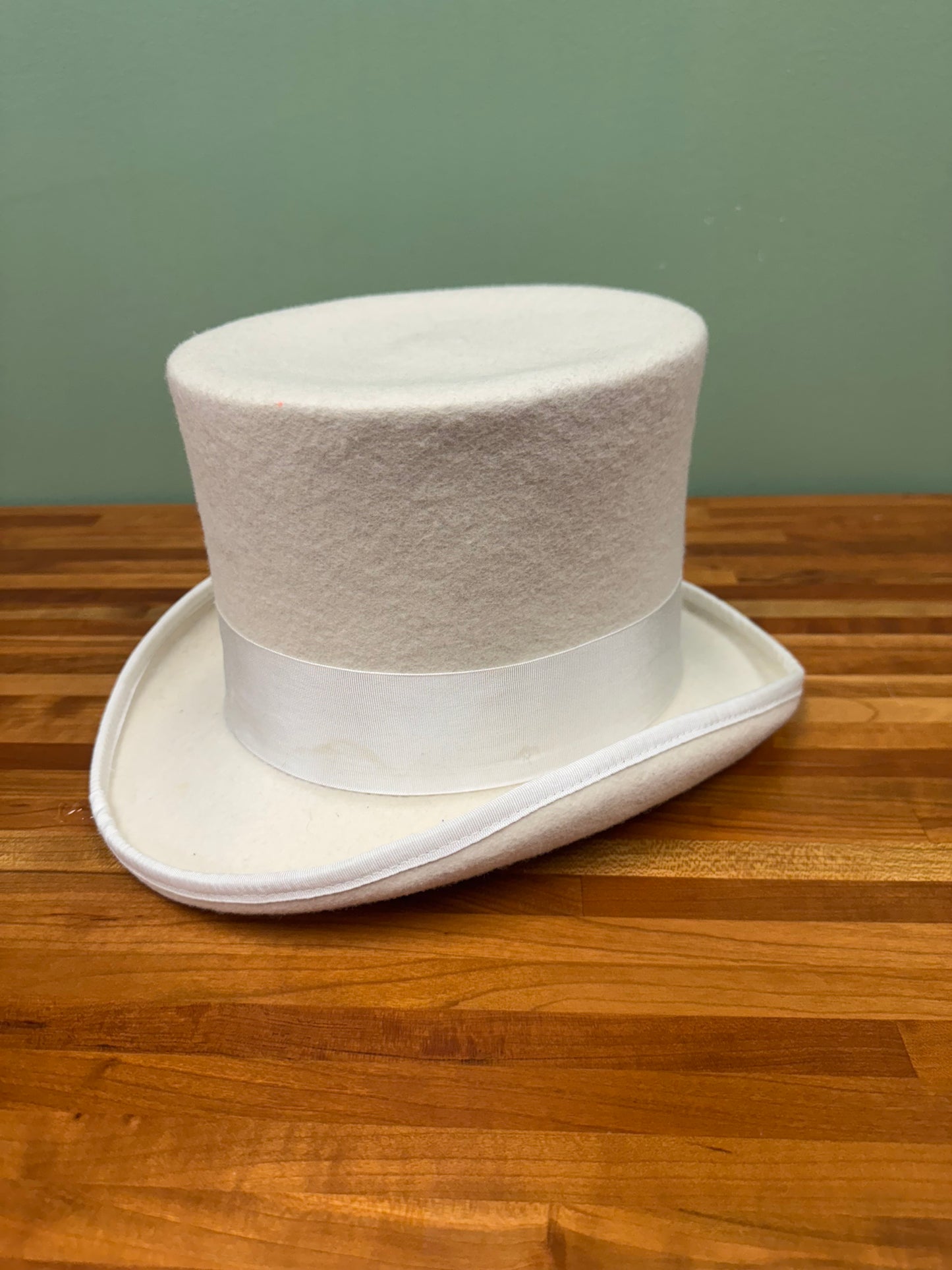 White Felt Top Hat With White Ribbon and Feathers